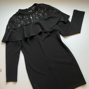 Black Mini Dress. Lace and ruffle details.